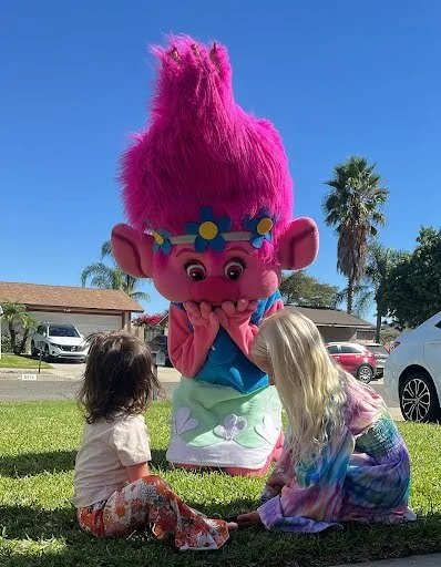 Pink Troll party character in Dallas